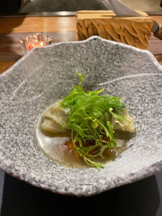 Mushroom cabbage rolls with a vegetable consomme