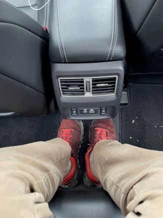Rear Seat Leg Room --  near flat bottom and not a l ot of cars allow me to put my legs in this position in the middle seat (I am 6ft)