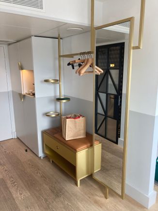 Left of entrance is an open wardrobe