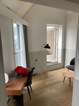 The living area has the desk and door to the terrace