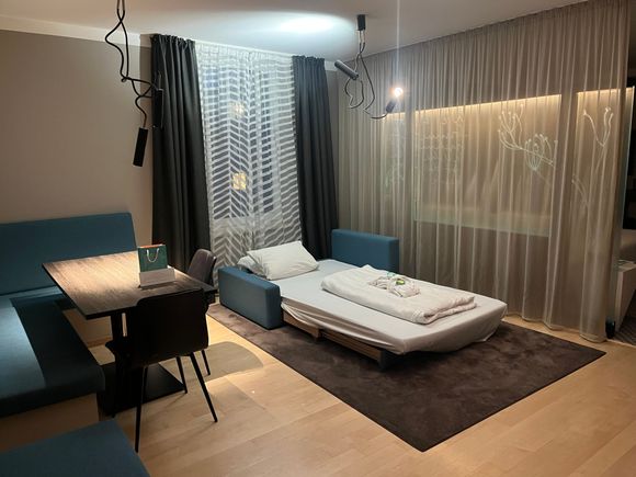 Urban Suite - living room made up into a bed (note - there is not a proper door separating this area from the bedroom, only a thin curtain)