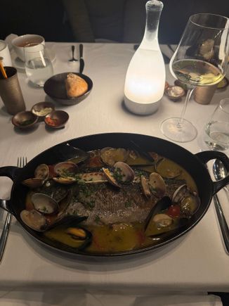 Whole fish with shellfish….lemon heavy with white wine,….delicious and light.