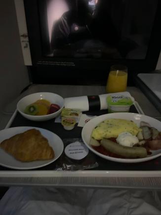I fell asleep almost immediately and woke up when the FA had my meal ready. I took a picture of it and fell asleep again until we were landing. Standard AC omelette which has been around forever.

