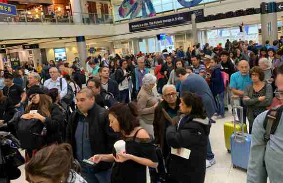 Huge crowd gathers trying to comprehend the (lack of) process being used for boarding