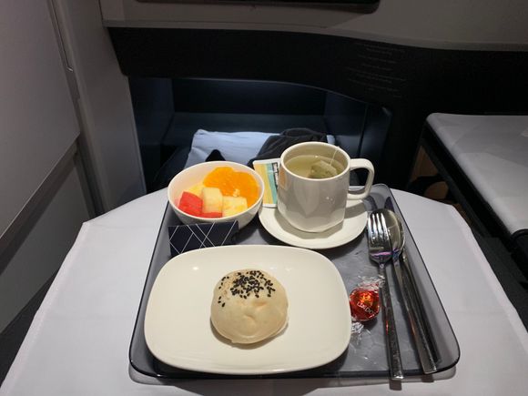 Mid-flight sesame pork bun