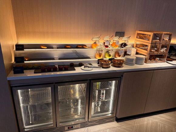 artful croissants over the denuded drink fridge