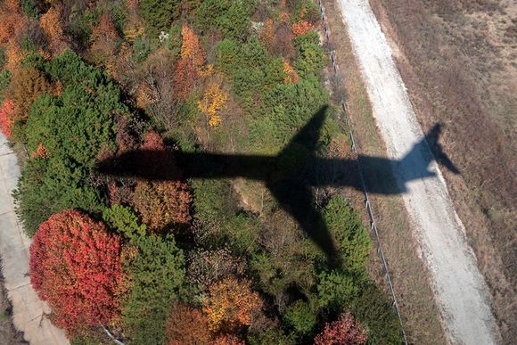 Something we won't see very much longer. The shadow of a MD88 on approach to ATL coming from HSV. Tail # N994DL