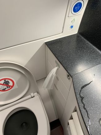 Toilet in A35K... Strange QR removed the toilet seat cover for wet towel. Not sure if this is a good thing on an aircraft...