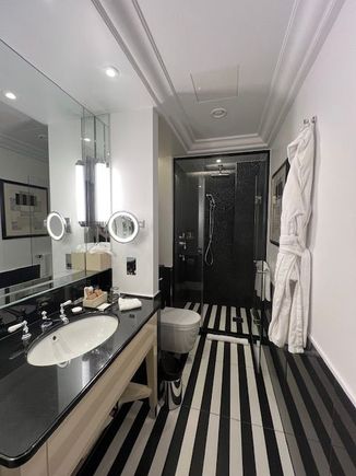 Bathroom with walk-in rain shower.