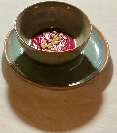 Amuse bouché - beetroot soup with pine nuts 