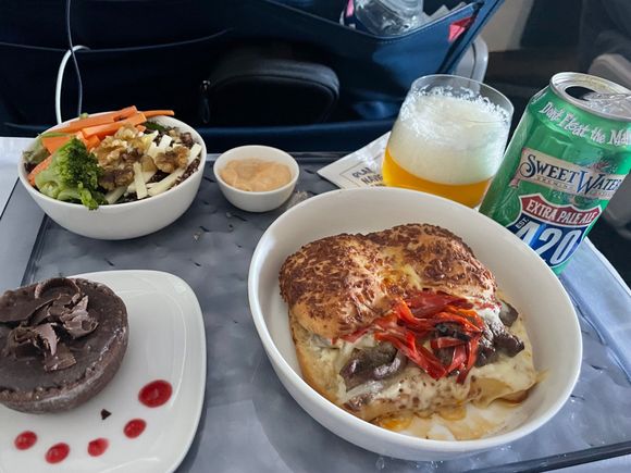 Beef Tenderloin sandwich - doesn't look great but was perfect for a mid afternoon flight. Salad was good as well but filled too high in the bowl and difficult to mix in with the dressing. Chocolate cake was blah and not finished.