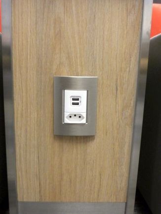 power plugs and USB charging ports at every seat. Note the absence of a socket suitable for US plugs