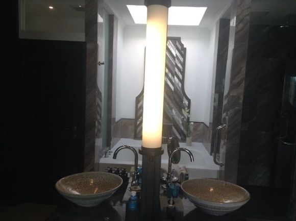 Bathroom - New his n hers in center instead of old partition. 
l/h wood door = toilet
open center = bath (new back tiling)
r/h glass door = shower , (both overhead rainfall    hand hand shower)