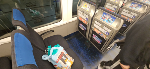 Skyliner train between Narita & Tokyo Ueno.  Such fast.  Much ads.  Wow.   (yes, that's a shiba inu bag, had to get some goodies for a friend that has an 8 mo old shiba pup).