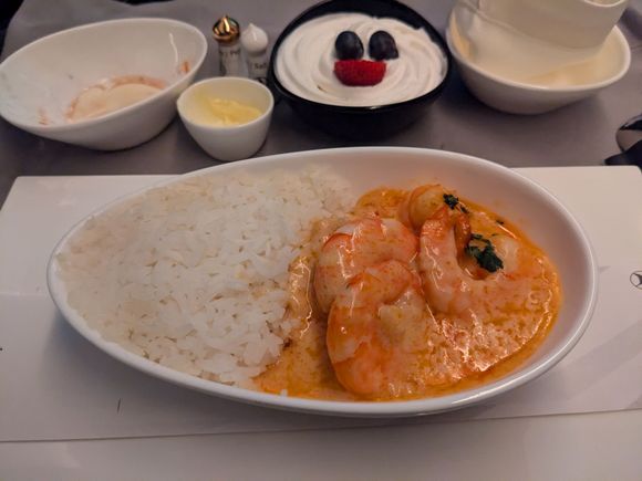 Prawns with curry sauce. This was very good. Shrimp were not overcooked but what I would consider 'well-done'.  Sauce was very very good, full of flavor, and filling, but surprisingly not greasy despite the visible oil. Rice was good, the edges had some slightly crispy bits from the reheating.