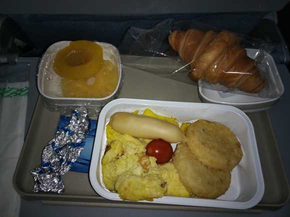 On a 2 hour flight from PEK - CSX this morning on Air China. This was served up in economy. I am so used to BYOB, I struggle to remember if BA used to serve hot food on short haul flights...
Food tasted awful, but it was nice to have a hot breakfast at the back of the plane :-)