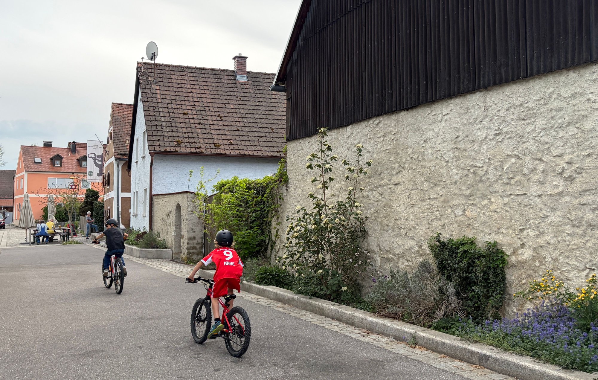 Kids chasing each other round the block on their bikes