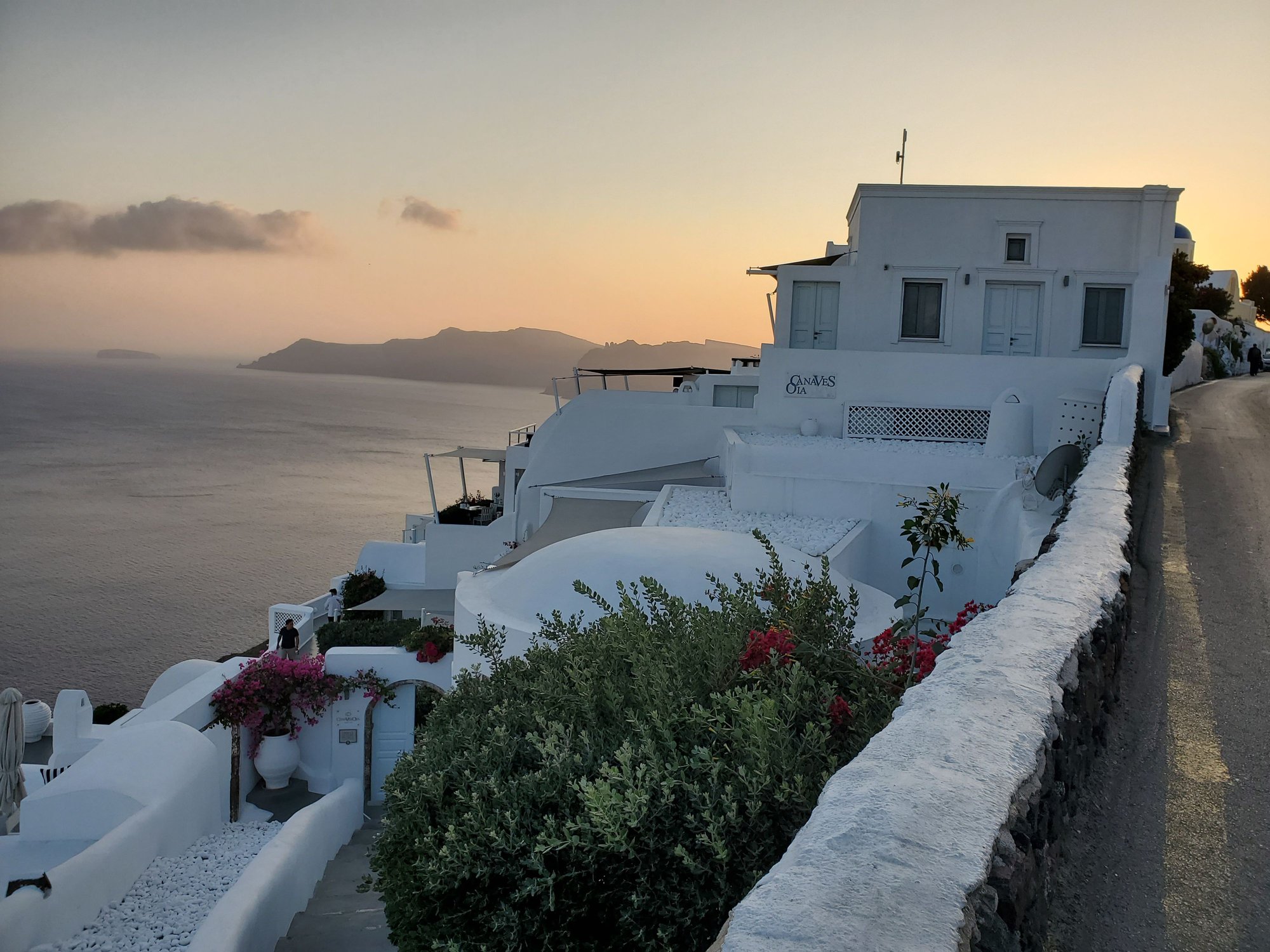 A peek of the Canaves Oia sign from the road.