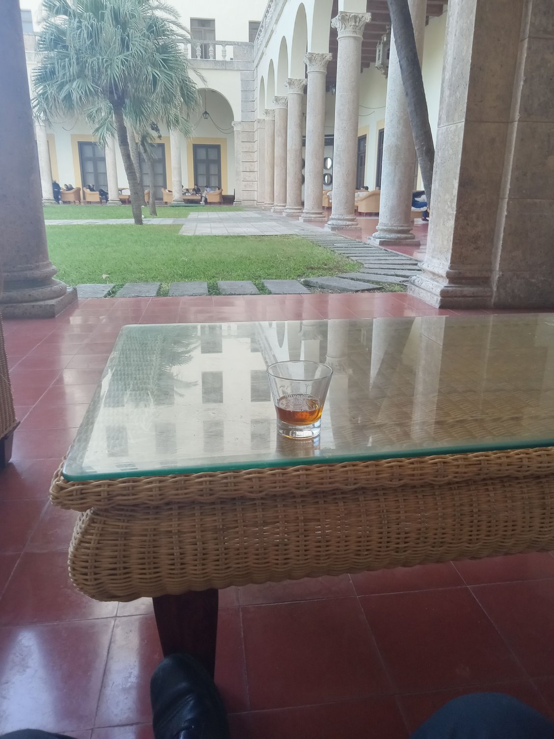 My left foot and rum in the gardens of the Nacional.