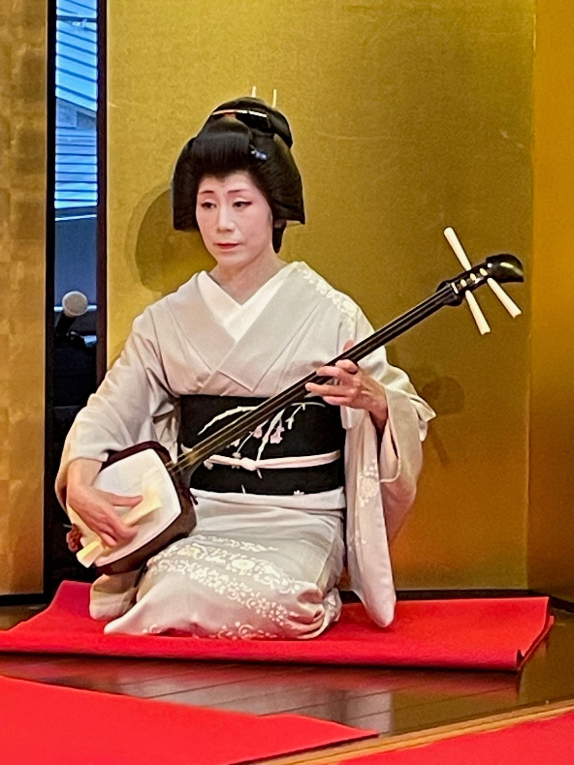 Geisha playing the shamisen