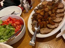 Salad, veal,  and potatoes 
And of course Apple strudel for dessert
Lots of wine and a good time was had by all