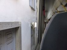 In the bus, passing homes in main street