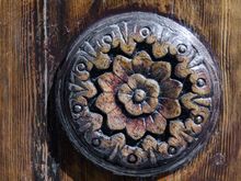 Detail of wooden door on same.