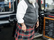 This person was a knife-sharpener at the Quimper weekly market. He worked from his vintage taxi vehicle. That Saturday was a busy day in that town. An outdoors table tennis tournament was also being held in the main St. Corentin Cathedral square 'Eveche' space. The permanent children's rides there had thus been supplemented by modern music, an announcer plus inflated arches above the ping pong tables. That same Saturday was also the twice-annual Braderie 'bric a brac' market. Busy busy busy.