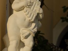 Fira statuary: cherub God Pan.