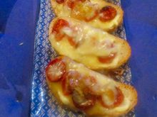 Toasts with tomatoes, cabécou, and honey