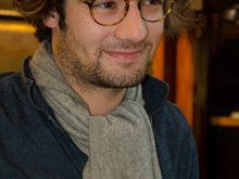 Young manager of Parisian art shop.