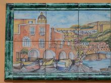Hand-painted tiles depict the lovely little enclave of Corricella. Another 'painters paradise'.