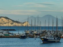 I think that maybe the bluffs in the foreground are Cape Miseno, once site of WWII defense guns. At this very moment, our return ferry back to ischia had just launched. We went atop to enjoy the marvelous, if breezy, atmosphere.