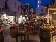 Just outside our rental: a shoulder season night scene along Ponte's main drag.