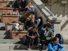 Sitting on the church steps. Locals or visitors?