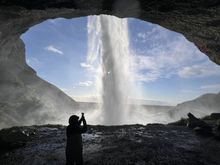 Standing in the cave behind Seljalandsfoss
