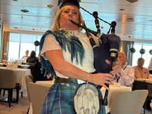 Serenaded at dinner by a famous female pipe player 
