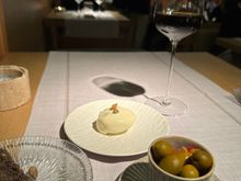 Black bread and delicious olives in the foreground, with that lovely tuna tomato inside cooked egg white concoction....a dish to which diners are "invited," as the menu notes.