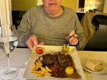 Perplexed diner eyeing his glazed pork cheeks, which he liked very much.