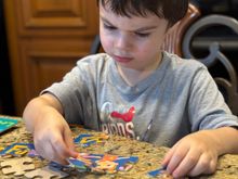 He seems to really enjoy putting puzzles together.