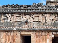 Above the door way is an upside down figure you can see his "frog" legs. I read this is a descending god