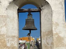 I know this looks just like the bell I posted yesterday, but it is actually from the other end of town.  You can almost see the Angel on the Malecon to the right of the bell
