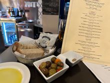 Bread, olives and the menu, which is augmented by the daily specials