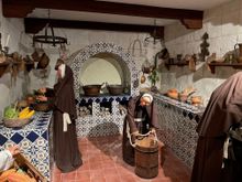 The nuns in the kitchen making and baking with chocolate.