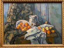 One of the great Cezanne still lifes.  It looks like the peaches are falling out of the plate