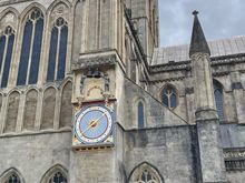 Big historic clock outside of the Cathedral on the east wall