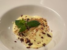 Ravioli stuffed with ricotta di bufala in a creamed potato sauce, topped with bits of hazelnut and crispy guanciale; this is a half portion