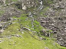 Long waterfall cascading down the mountain