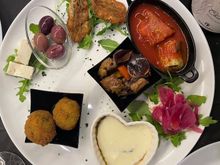Appetizer sampler for two: feta, olives, fried anchovies, mackerel/carmelized onions, caponata and a few other things