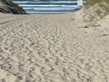 Finally we are at the beach, we can see it rising up ahead as we climb the last dune.
